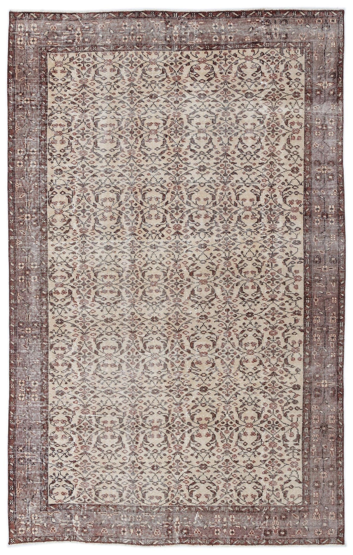 Distressed brown and beige rug with a repeating floral medallion pattern and a wide, ornate border.