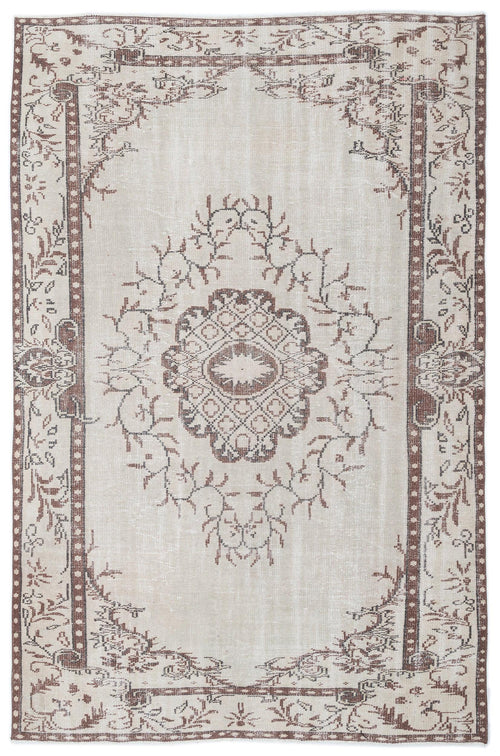Load image 1 in gallery view. Beige and brown vintage-style rug with a central floral medallion and a decorative border.