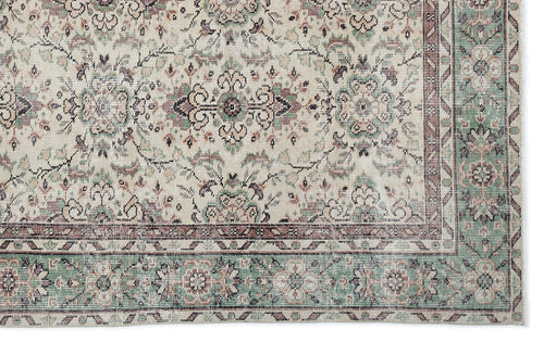 Load image 1 in gallery view. Cream rug with a traditional floral medallion pattern in sage green, dusty rose, and charcoal on a white background.