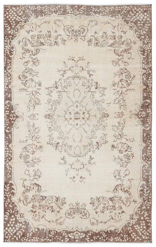 Load image 1 in gallery view. Beige and brown distressed rug with a central floral medallion and ornate border pattern.