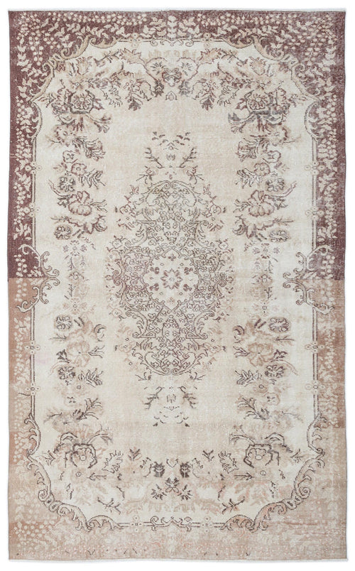 Load image 1 in gallery view. Distressed beige and brown rug with a central floral medallion and ornate border pattern on a white background.