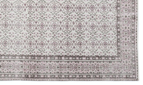 Load image 1 in gallery view. Off-white and dusty rose rug with a repeating geometric medallion pattern and a wide, detailed border.