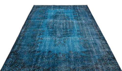 Load image 1 in gallery view. Distressed blue and black vintage-style rug with a central medallion and ornate border on a white background.