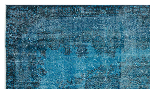 Load image 1 in gallery view. Teal and navy blue distressed rug with a faded traditional floral medallion pattern.