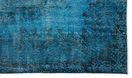 Load image 1 in gallery view. Deep blue distressed rug with a faded floral pattern and dark navy border.
