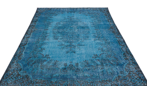 Load image 1 in gallery view. Bright blue distressed rug with a dark charcoal floral medallion and ornate border on a white background.