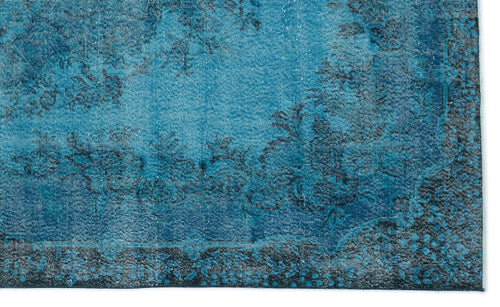 Load image 1 in gallery view. Teal and black distressed rug with a traditional floral medallion pattern and a dark border.