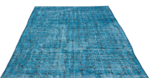 Load image 1 in gallery view. Bright blue distressed rug with a faded, dark grey traditional medallion pattern on a white background.