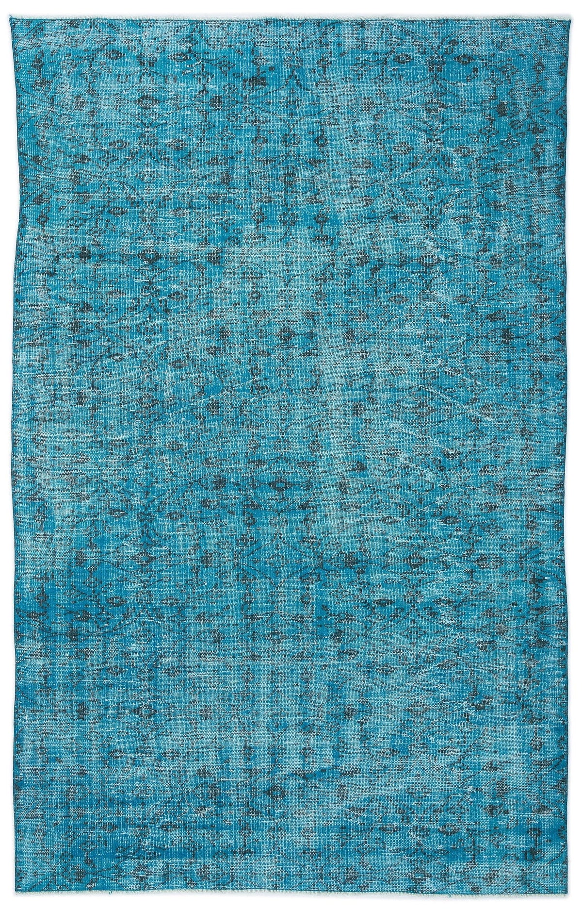 Bright blue distressed rug with a faded charcoal grey traditional medallion pattern on a white background.