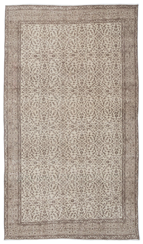 Load image 1 in gallery view. Taupe and cream vintage-style rug with a repeating floral medallion pattern and a wide decorative border.