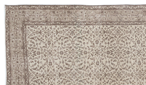 Load image 1 in gallery view. Taupe and cream rug with a distressed traditional floral medallion pattern and a wide decorative border.