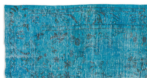 Load image 1 in gallery view. Bright turquoise rug with a distressed, faded traditional medallion pattern in dark charcoal.