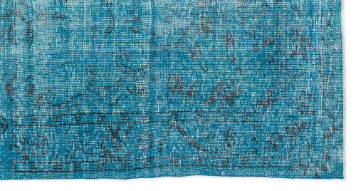 Load image 1 in gallery view. Teal and black distressed rug with a traditional ornate medallion pattern and a bordered edge.