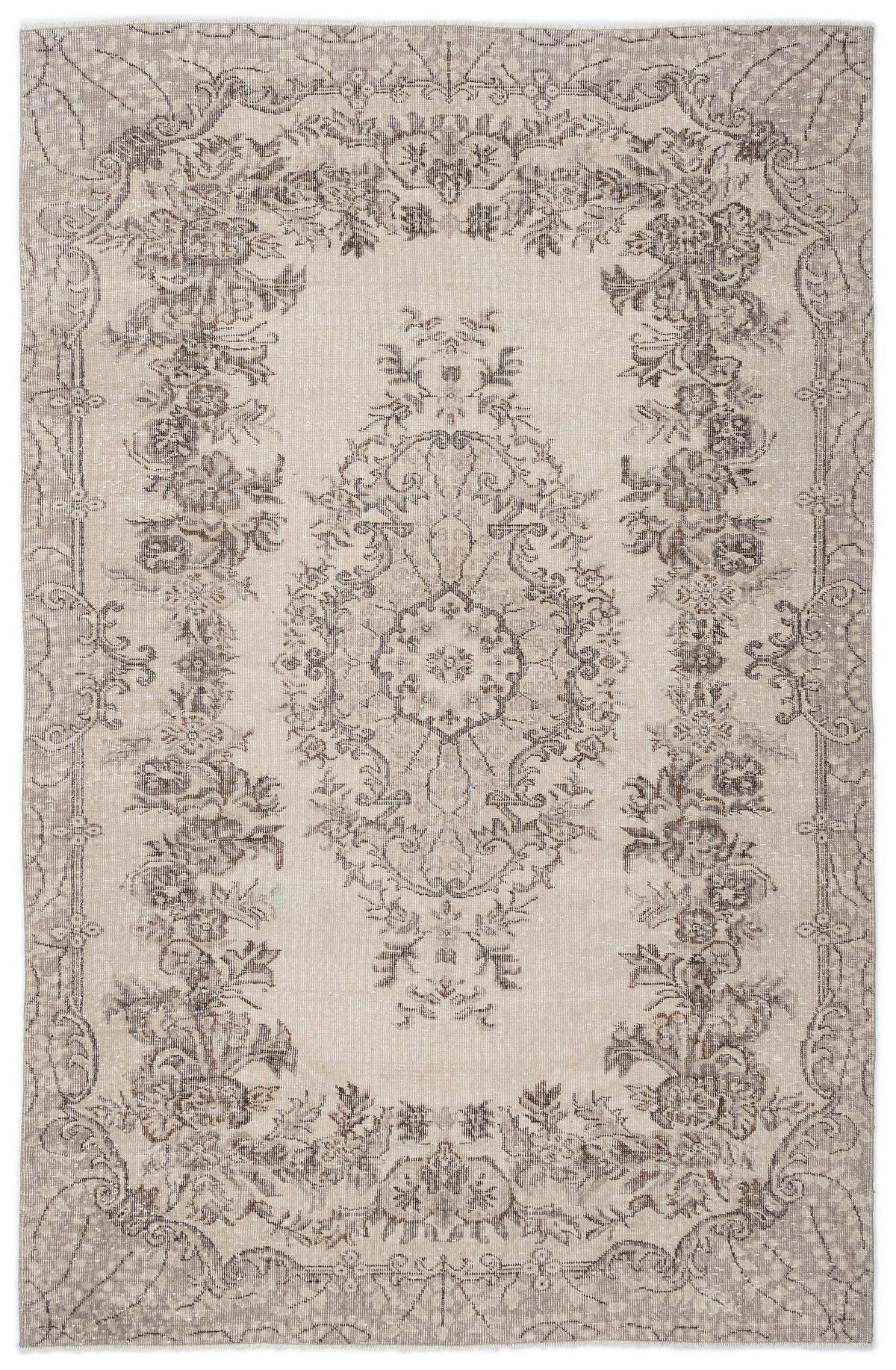 Beige and taupe distressed rug with a central floral medallion and ornate botanical border.