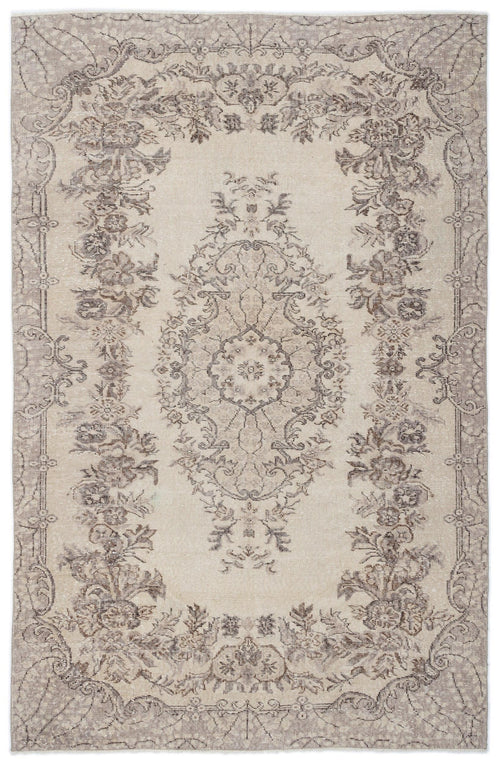 Load image 1 in gallery view. Beige and taupe distressed rug with a central floral medallion and ornate botanical border.