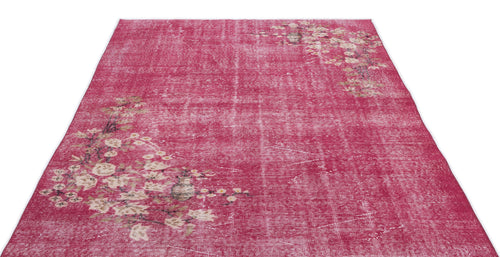 Load image 1 in gallery view. Distressed magenta rug with a faded floral pattern in cream and brown, isolated on a white background.