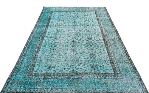 Load image 1 in gallery view. Teal and charcoal distressed area rug with a traditional floral medallion pattern and a wide decorative border.