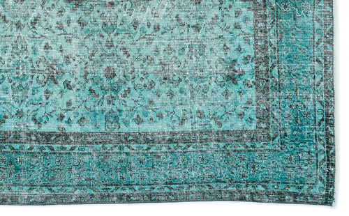 Load image 1 in gallery view. Teal and black distressed rug with a traditional floral medallion pattern and a geometric border.