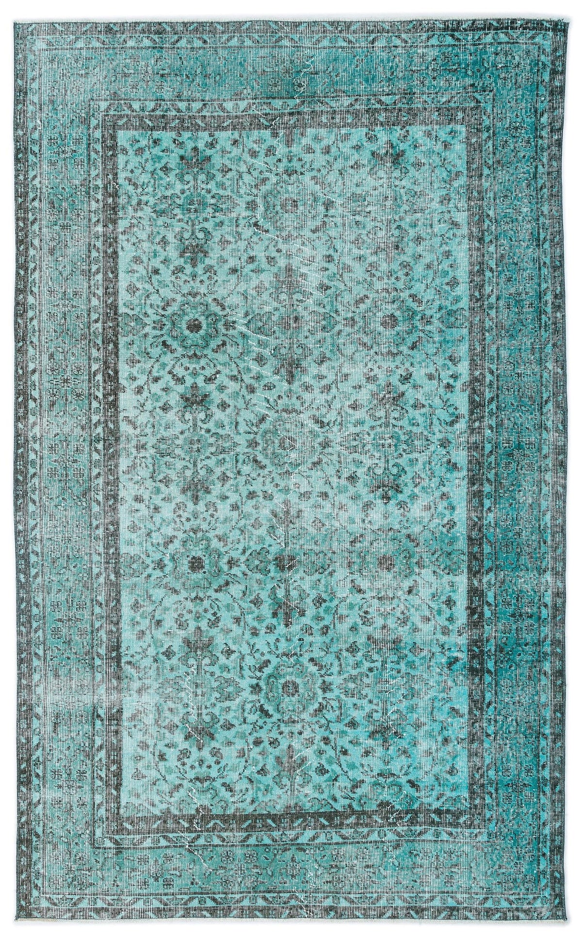 Distressed teal and charcoal rug with a traditional floral medallion pattern and a wide decorative border.