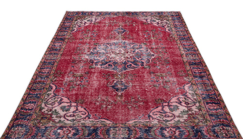 Load image 1 in gallery view. Distressed red and navy blue traditional rug with a central floral medallion and ornate border on a white background.