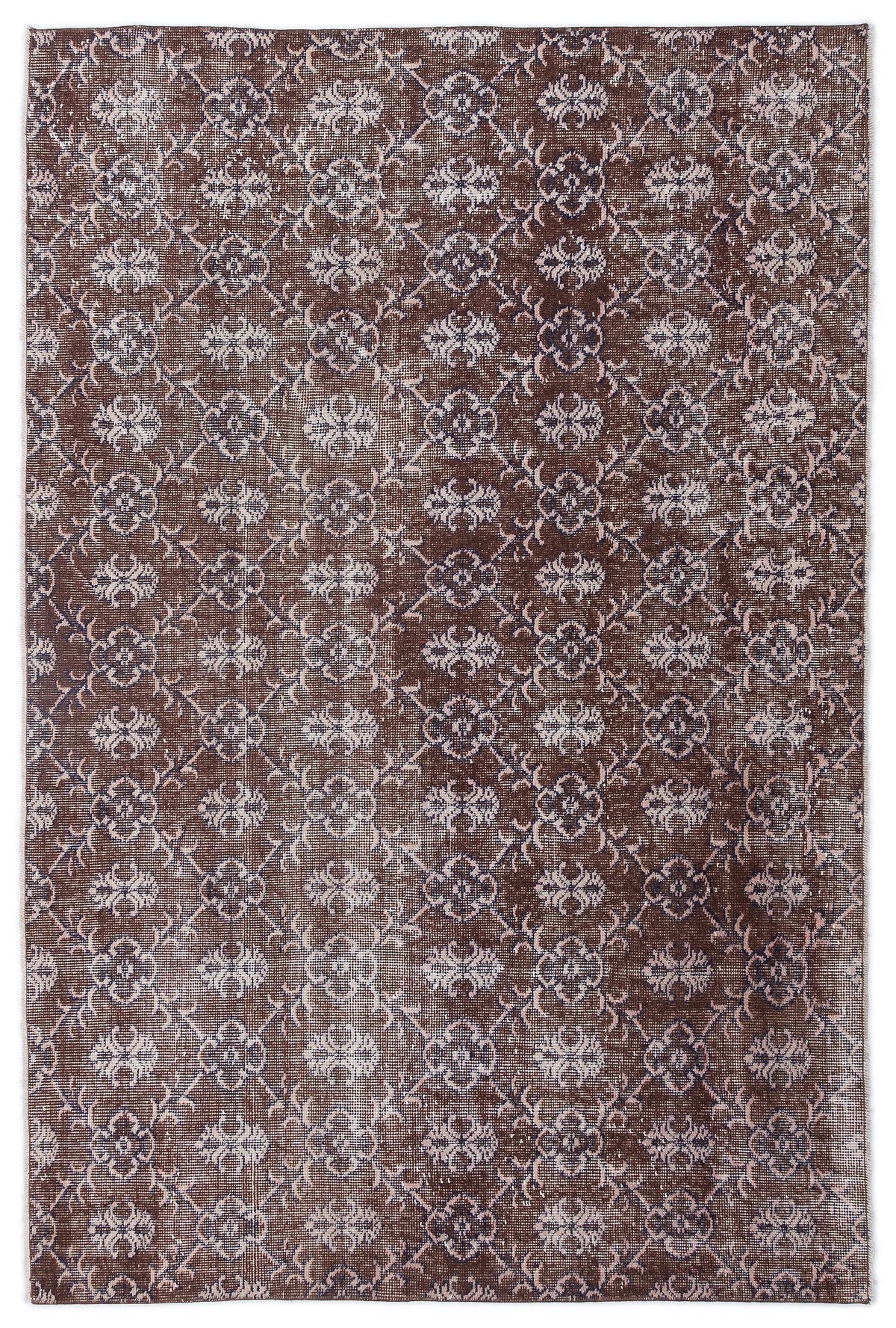 Dark brown distressed rug with a repeating cream and muted blue floral trellis pattern.