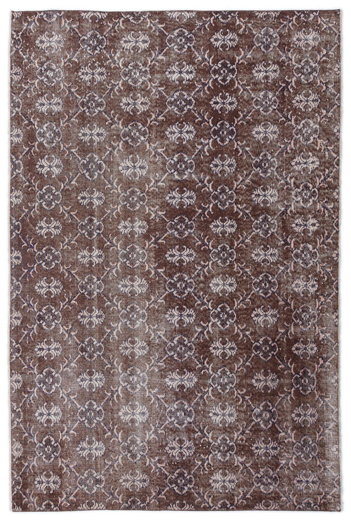 Load image 1 in gallery view. Dark brown distressed rug with a repeating cream and muted blue floral trellis pattern.