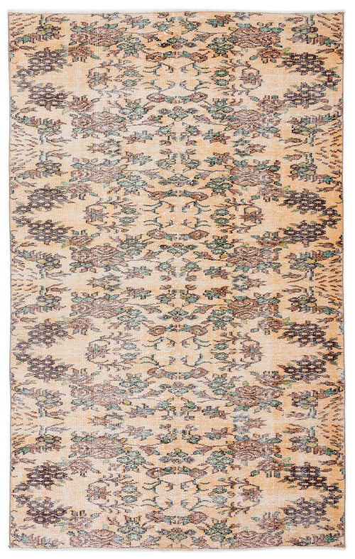 Load image 1 in gallery view. Peach-toned distressed rug with a repeating dark brown and sage green floral medallion pattern.