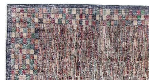 Load image 1 in gallery view. Distressed multi-colored rug with a checkered border and a textured, variegated center field.