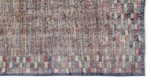 Load image 1 in gallery view. Distressed multi-colored rug with a textured, pixelated grid pattern and a dark blue border on a white background.