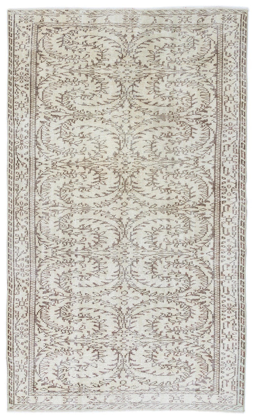 Load image 1 in gallery view. Beige and brown vintage-style rug with a symmetrical floral vine pattern and a decorative border on a white background.