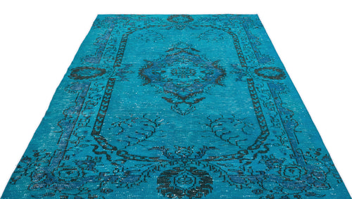 Load image 1 in gallery view. Turquoise and navy blue distressed rug with a traditional central medallion and ornate border pattern.