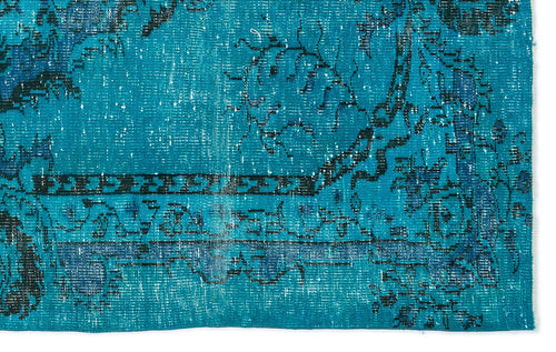 Load image 1 in gallery view. Teal and blue distressed rug with a traditional black floral medallion pattern and a geometric border.