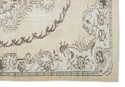 Load image 1 in gallery view. Beige and brown rug with a distressed traditional floral medallion pattern and a decorative border.