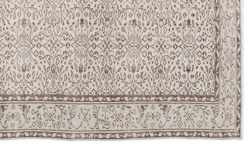 Load image 1 in gallery view. Beige and brown rug with a traditional distressed floral pattern and a detailed border.