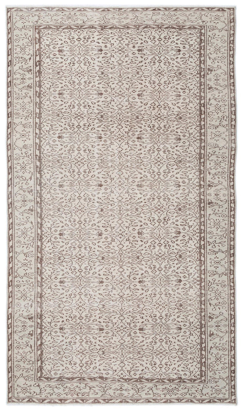 Load image 1 in gallery view. Beige and brown area rug with a traditional floral medallion pattern and a decorative border on a white background.