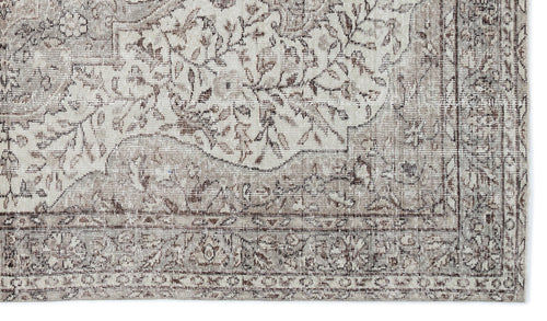 Load image 1 in gallery view. Taupe and cream rug with a distressed traditional floral medallion pattern and a detailed border.