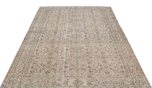 Load image 1 in gallery view. Beige and grey distressed rug with a traditional floral medallion pattern and a detailed border on a white background.