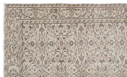 Load image 1 in gallery view. Beige and brown distressed rug with a traditional floral trellis pattern and a decorative border.