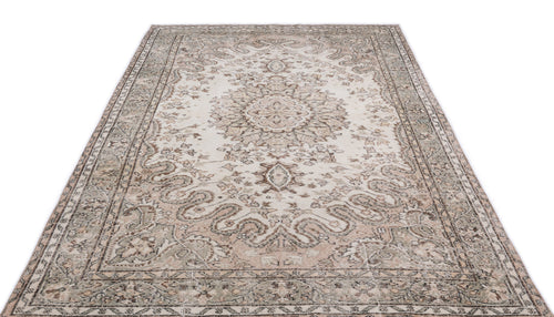 Load image 1 in gallery view. Distressed beige and sage green area rug with a traditional central medallion and ornate floral border.