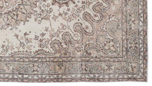 Load image 1 in gallery view. Distressed cream, taupe, and sage green rug with a traditional floral medallion pattern and a decorative border.