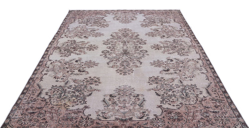 Load image 1 in gallery view. Distressed light gray rug with a faded mauve and charcoal floral medallion pattern on a white background.