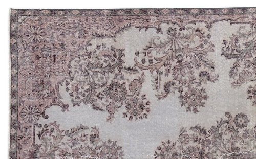 Load image 1 in gallery view. Distressed grey and mauve rug with a traditional floral medallion pattern and a decorative border.
