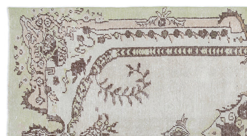 Load image 1 in gallery view. Distressed sage green and beige rug with a faded brown traditional floral medallion pattern.