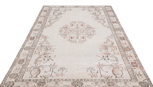 Load image 1 in gallery view. Cream area rug with a central medallion and floral border in muted brown and terracotta tones.