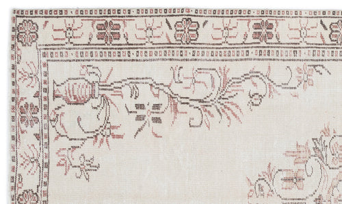 Load image 1 in gallery view. Cream rug with a faded brown and terracotta floral border and stylized botanical motifs on a white background.
