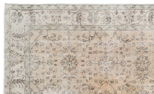 Load image 1 in gallery view. Beige and cream traditional rug with a distressed floral medallion pattern and a detailed border.