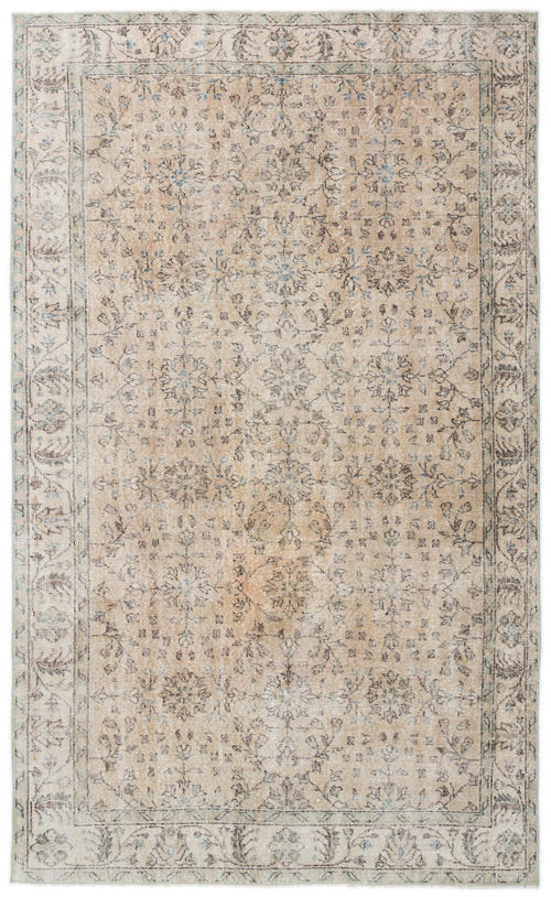 Load image 1 in gallery view. Beige and grey distressed traditional rug with a faded floral medallion pattern and a decorative border.