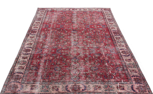 Load image 1 in gallery view. Distressed red traditional rug with a faded floral medallion pattern and a wide, ornate border on a white background.