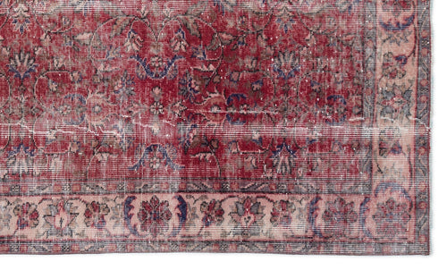 Load image 1 in gallery view. Distressed red traditional rug with blue and beige floral medallion patterns and a wide decorative border.
