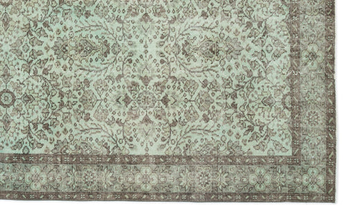 Load image 1 in gallery view. Mint green and brown rug with a distressed traditional floral medallion pattern and a wide decorative border.